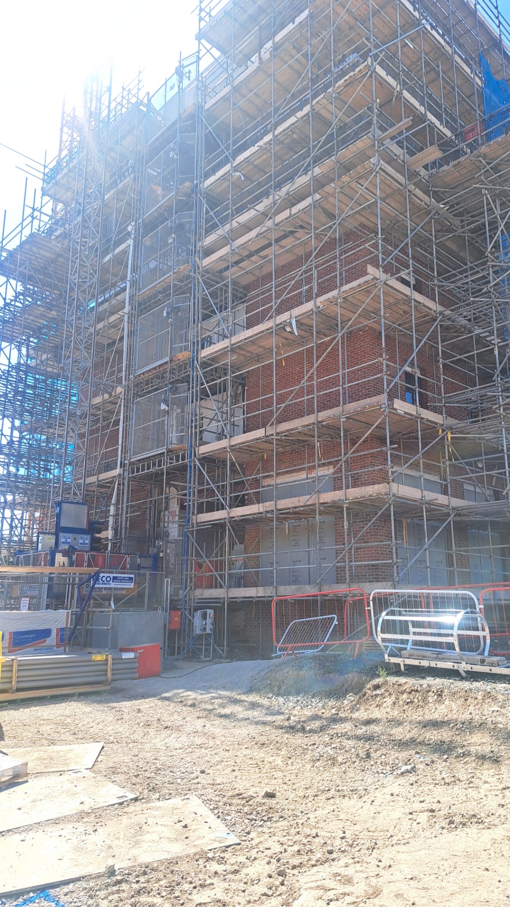 Brickwork cleaning on a scaffolded new-build